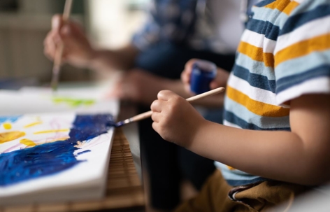 mother and son painting close-up