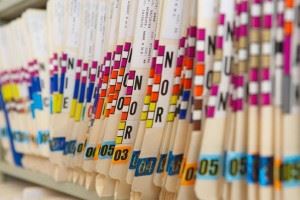 multicolored labeled manila folders with medical records