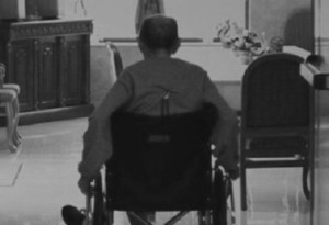 Man in wheelchair in nursing home