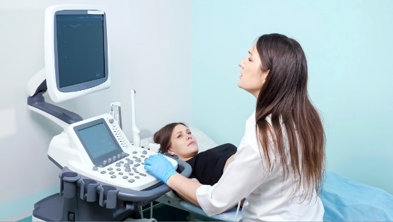 confused doctor doing an ultrasound test on pregnant woman