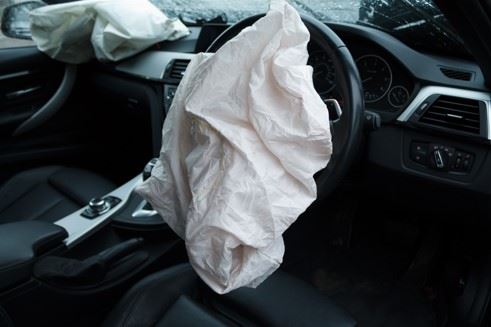 deployed airbag in drivers seat