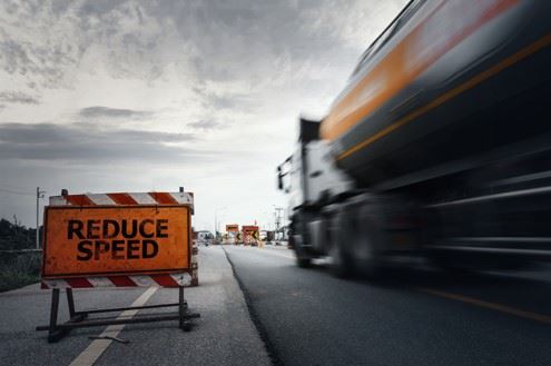 semi truck speeding through construction zone